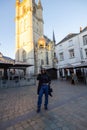 Fashionable Urbanite Against Cathedral Backdrop