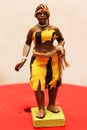 Colorful Traditions of Ghana: Clay Figurine Depicts a Young Lady Getting Ready to Dance.