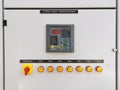 Image of power factor indicator on the door low voltage switchboard. Selective focus.