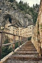 Image of Predjamski castle with stairs in the foreground Royalty Free Stock Photo