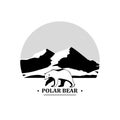 Polar bear symbol on a background of mountains.