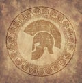 Spartan helmet an icon on old paper in style grunge, is issued in antique Greek style.