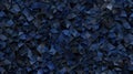 A digital illustration of a dense collection of dark blue, triangular shapes.