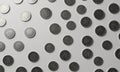 grid black and white coins arranged in diagonal pattern against white background. Royalty Free Stock Photo