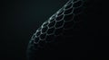 A close-up view of a textured surface, possibly a mesh or honeycomb, against a dark background. Royalty Free Stock Photo
