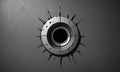 metallic circle with central hole is surrounded by sharp, pointed spikes on dark background. Royalty Free Stock Photo