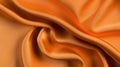 A close-up view of a flowing, orange fabric with a subtle sheen. Royalty Free Stock Photo