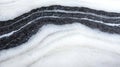 A close-up view of a snow-covered surface with distinct black and white stripes. Royalty Free Stock Photo