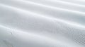 A close-up view of a white fabric with a subtle texture. Royalty Free Stock Photo