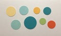 Nine circles varying sizes and colors are arranged in grid-like pattern on white background. Royalty Free Stock Photo