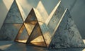 collection three triangular sculptures, each with unique design, is arranged on blue surface, with the