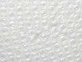 This image presents a detailed close-up view of a white bubble wrap material. The surface is filled with numerous small, rounded Royalty Free Stock Photo