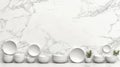 A minimalist display of white bowls and plates against a marble wall. Royalty Free Stock Photo