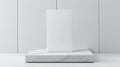 A white rectangular box on a marble pedestal. Royalty Free Stock Photo