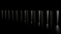 A row of identical black cylindrical containers. Royalty Free Stock Photo