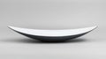 A white bowl with a black rim sits on a gray background. Royalty Free Stock Photo