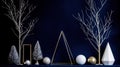 A collection of Christmas decorations in white, silver, gold, and blue. Royalty Free Stock Photo