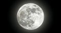 Dramatic full moon shining brightly in black space Royalty Free Stock Photo