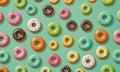 vibrant pattern 24 donuts in various colors and flavors, arranged in grid-like fashion against green Royalty Free Stock Photo