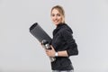 Image of pretty blond woman 20s dressed in sportswear carrying yoga mat while walking