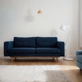 Pretty simple decor of living room with blue sofa and light blue wall