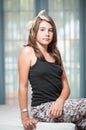 .Image of pretty teenager posing indoor in a good mood