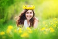 Image of pretty woman lying down on dandelions field, happy che Royalty Free Stock Photo