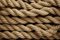 This image provides a detailed close up view of a rope, showcasing its twisted fibers, ideal for knot tying and securing objects,