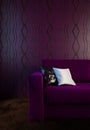 Image of the purple couch in the interior in dark colors.