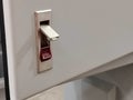 Image of push latch without key lock on electrical cabinet Royalty Free Stock Photo