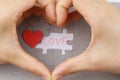 Image of Puzzle piece with love and red love hand Royalty Free Stock Photo