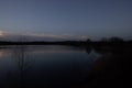 Evening Calm on a Hushed Lake