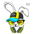 The image of rabbit in the glasses, headphones and in hip-hop hat. Vector illustration.