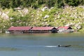 Image of raft floating on the water and long tail boat Royalty Free Stock Photo