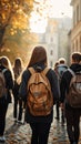 Image Rear view of a group of students walking with school backpacks