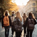 Image Rear view of a group of students walking with school backpacks