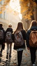 Image Rear view of a group of students walking with school backpacks