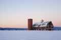 Image of a red barn with a field of snow Royalty Free Stock Photo