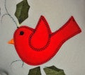 Image of a red bird stiched on a tissue Royalty Free Stock Photo