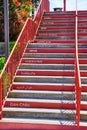 Red Golden Gate Bridge stairs with welcome said in different languages on steps