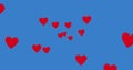 Image of red hearts spread on blue background Royalty Free Stock Photo