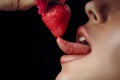 image of red lips kissing strawberry. Passion and desire. Perfect skin Royalty Free Stock Photo