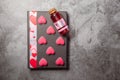 Red love potion with pink heart shaped sweets