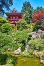 Red pagoda in Japanese Tea Garden on bright summer day with bright blue sky behind trees Royalty Free Stock Photo