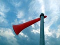 A red plastic horn tie with a white plastic pipe with blue sky background Royalty Free Stock Photo