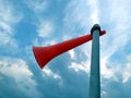 A red plastic horn tie with a white plastic pipe with blue sky background Royalty Free Stock Photo