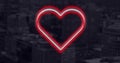 Image of red and white neon hearts flashing on dark cityscape
