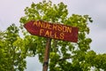 Road sign for Anderson Falls with green trees in background Royalty Free Stock Photo