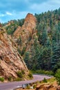 Road through valley with large rock mountain pillars and pine trees Royalty Free Stock Photo