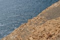 Image of rocky limestone formation in the middle and the blue sea in the other half Royalty Free Stock Photo